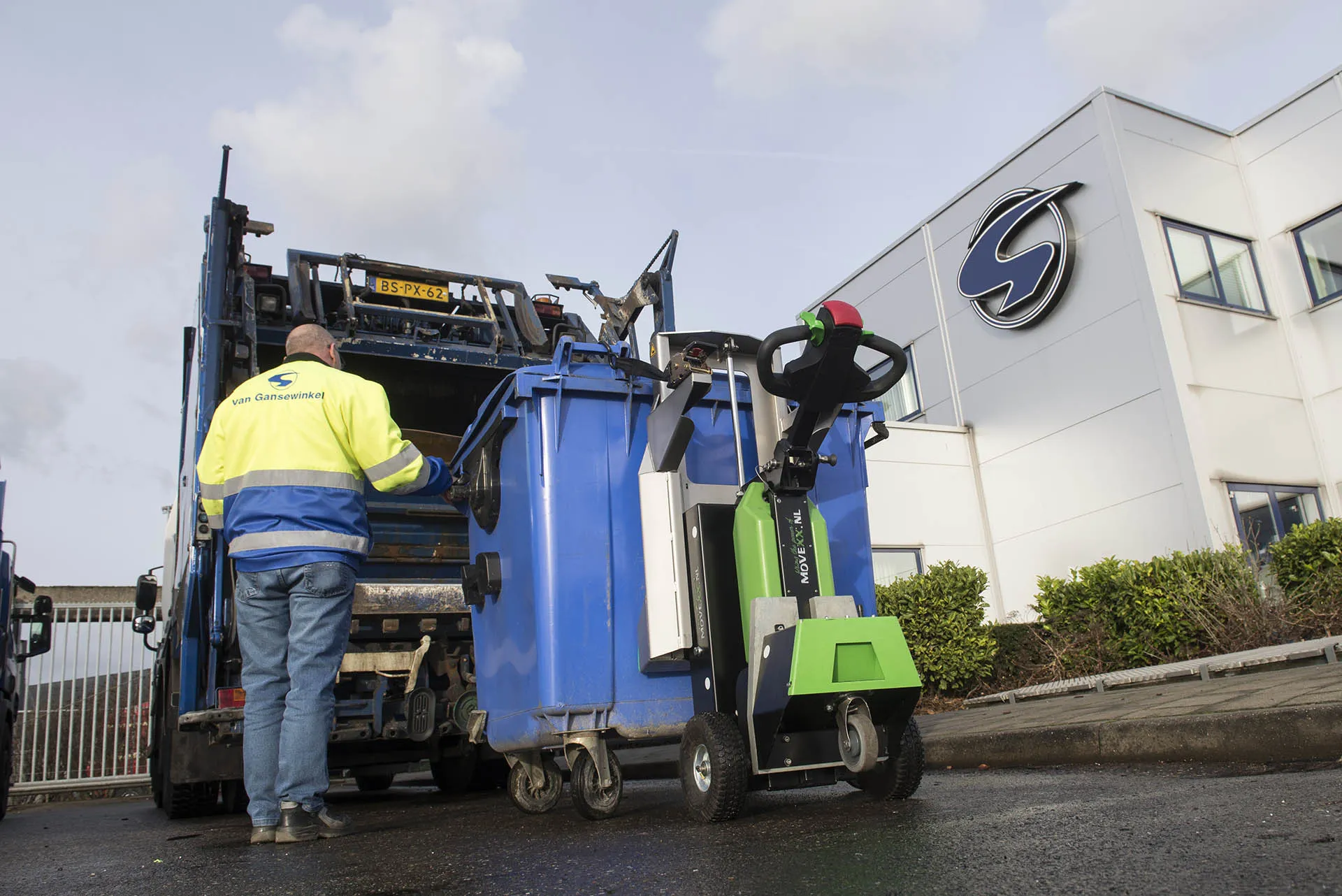 MOVEXX electric tug moving waste bins on a collection round