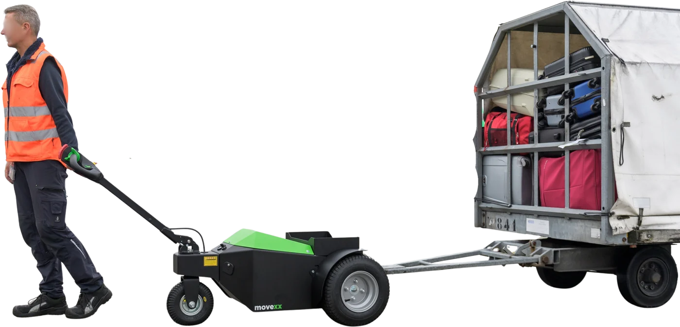 MOVEXX TT2500 electric tug towing an airport baggage cart