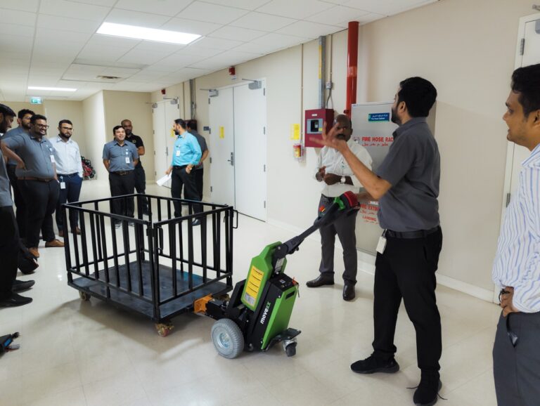 ADW Machinery demonstrating how the MOVEXX TT1500-T electric tug couples to a supply cage at a private hospital in Dubai